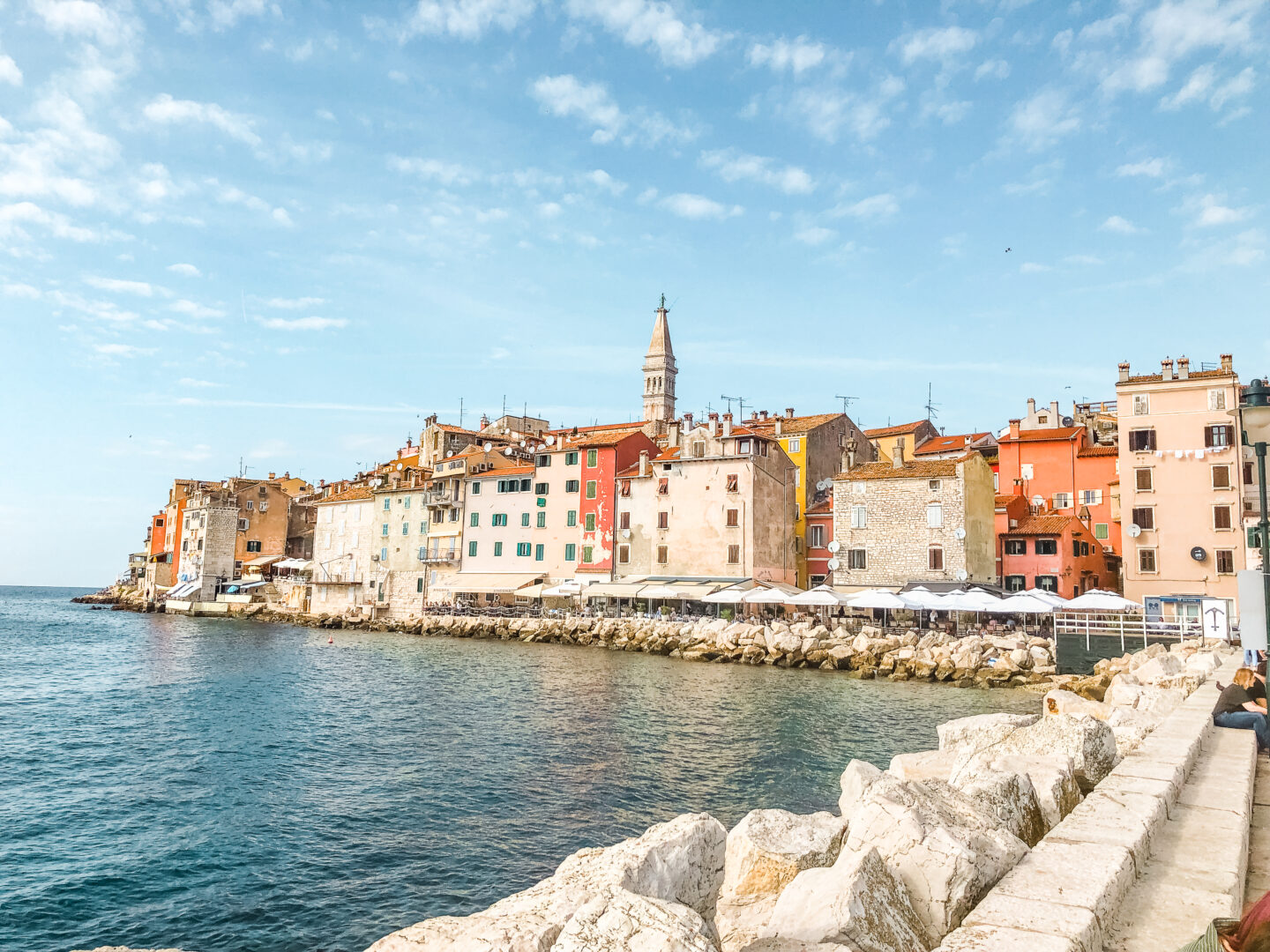 colorful buildings along water in rovinj croatia