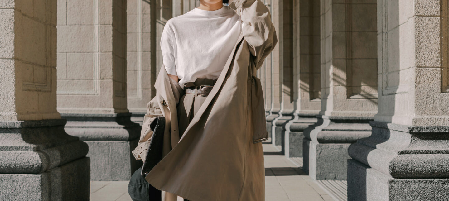 woman in white t-shirt, beige trench coat and matching beige trousers