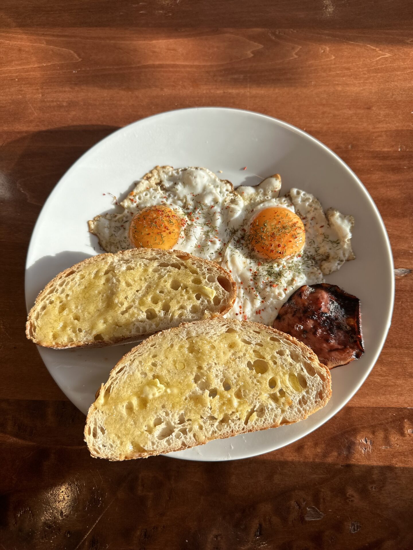 plate of breakfast food. eggs bacon toast